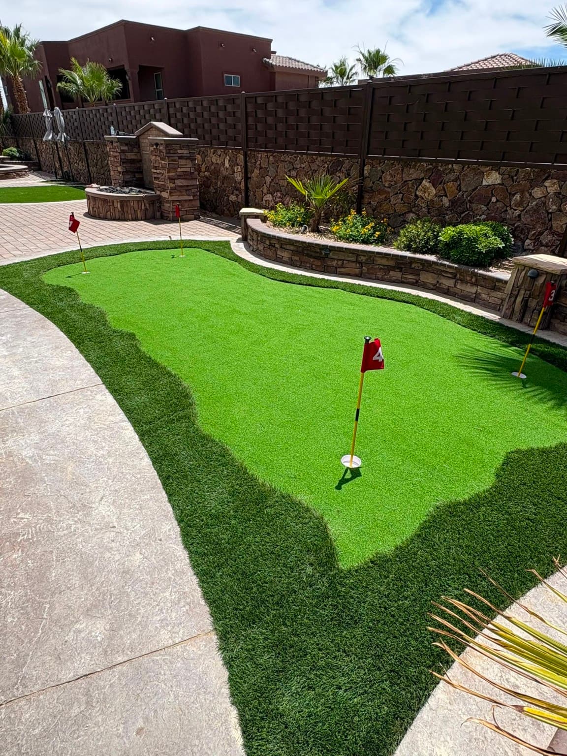 Custom backyard putting green installed in El Paso